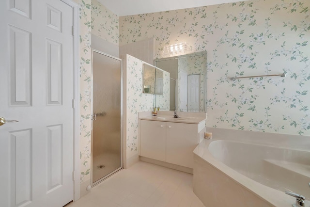 bathroom with tile patterned floors, independent shower and bath, and vanity