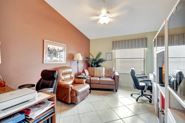 tiled office space featuring ceiling fan and lofted ceiling