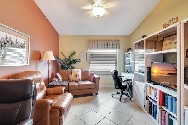 home office with vaulted ceiling and light tile patterned floors