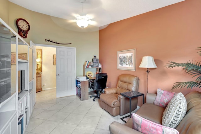 living room featuring ceiling fan and light tile patterned floors