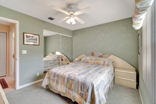 carpeted bedroom with ceiling fan