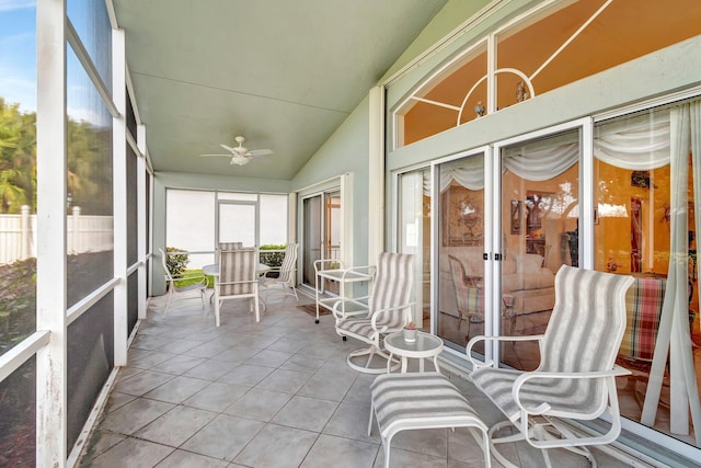 unfurnished sunroom featuring vaulted ceiling and ceiling fan