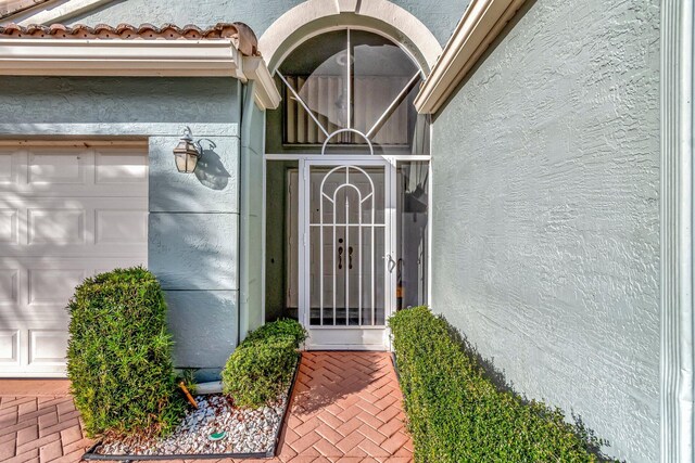 tiled foyer entrance featuring a towering ceiling