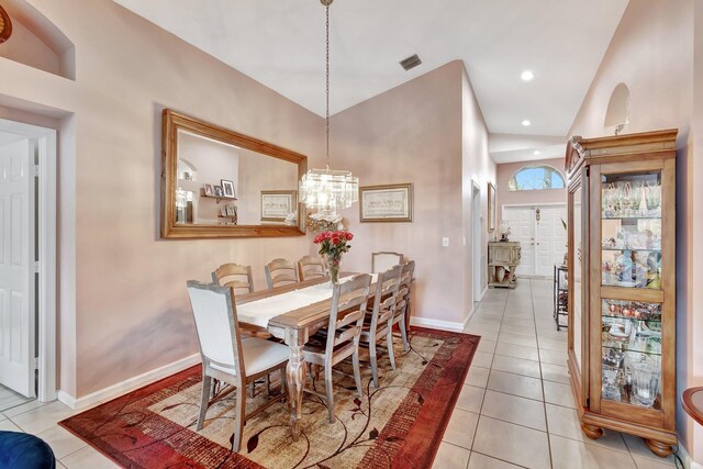 living room with vaulted ceiling, ceiling fan, and light tile patterned flooring