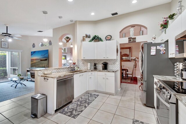 tiled foyer entrance featuring plenty of natural light and a high ceiling