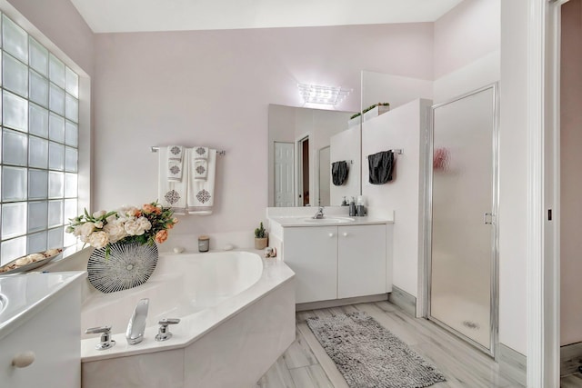 bathroom featuring plus walk in shower and vanity