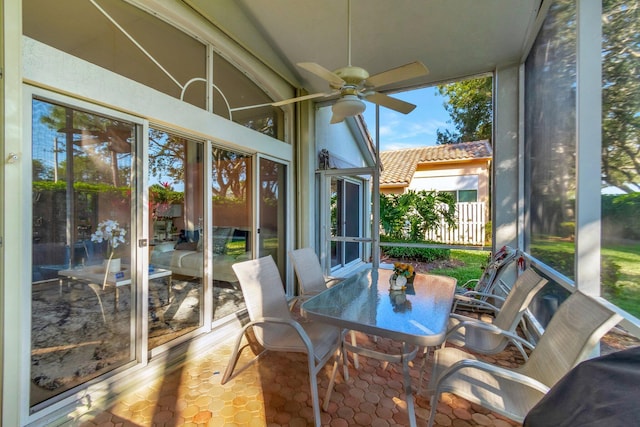 sunroom / solarium with ceiling fan