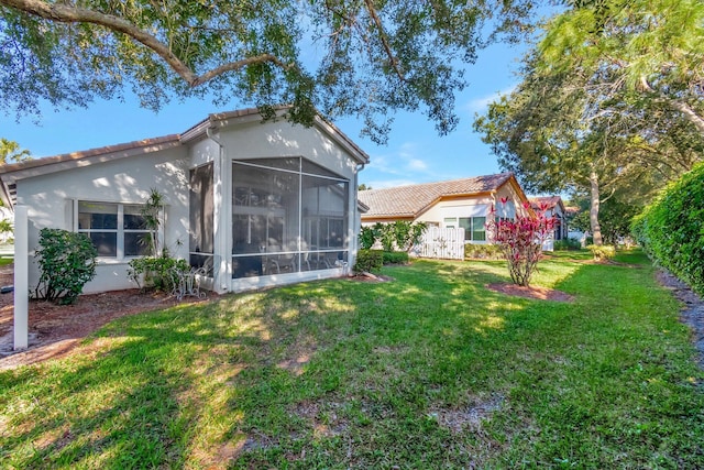 view of yard featuring a sunroom