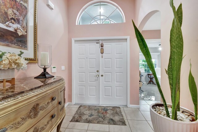 corridor with light tile patterned flooring