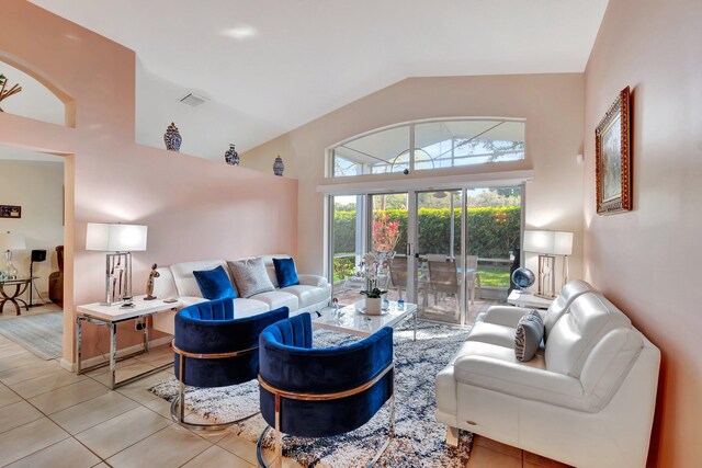 dining space with light tile patterned flooring and an inviting chandelier