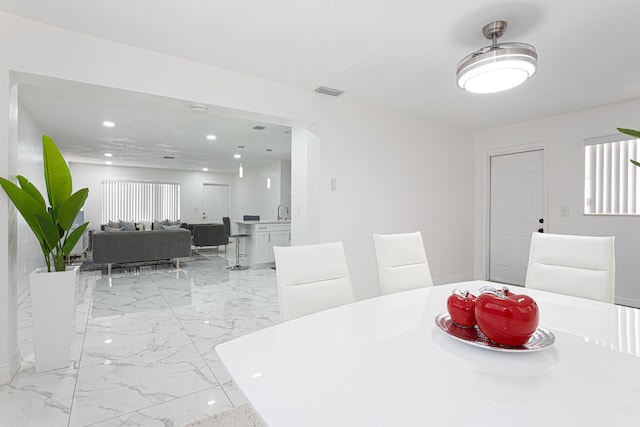 dining space featuring sink