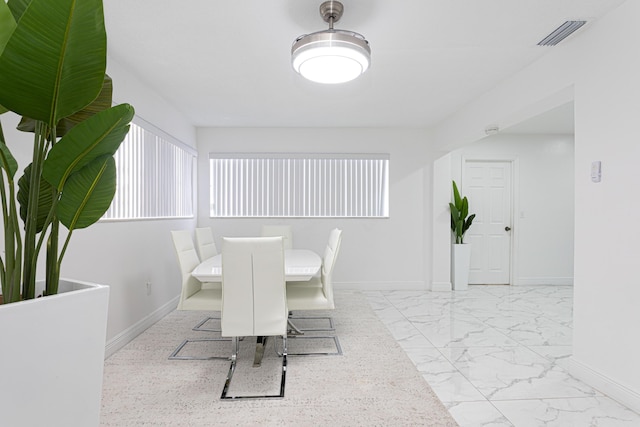 dining area featuring a wealth of natural light