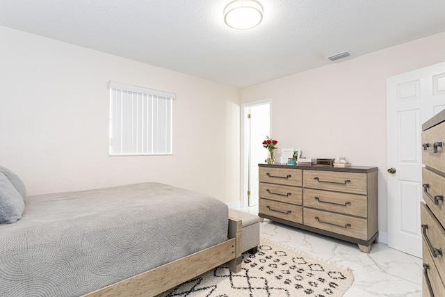 bedroom with a textured ceiling