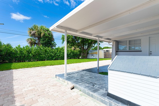 view of patio featuring a shed