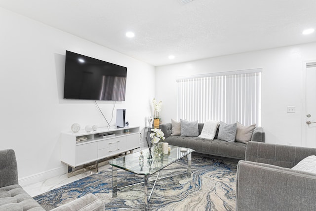 living room with a textured ceiling