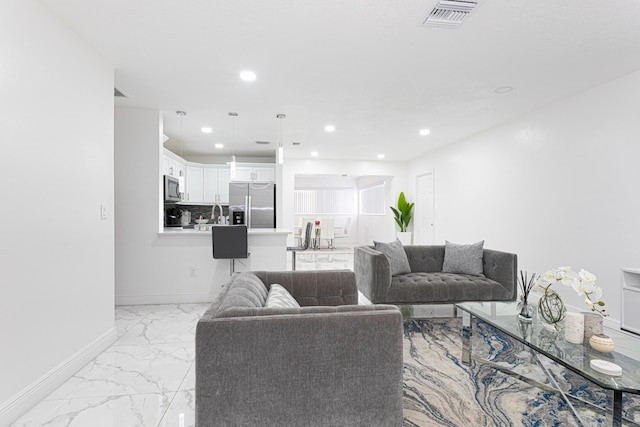 living room featuring sink