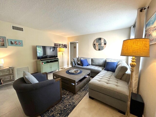 carpeted bedroom with a textured ceiling