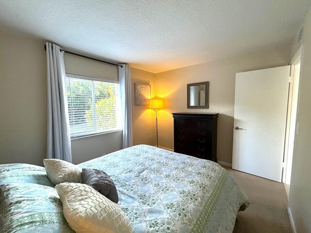 bedroom with carpet and a closet