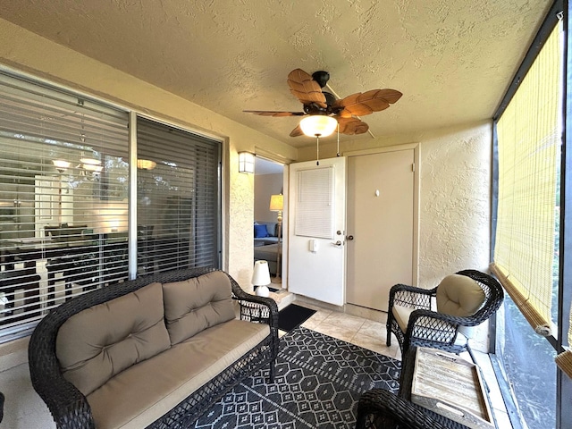 sunroom with ceiling fan