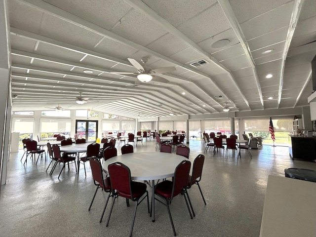 dining room featuring ceiling fan and lofted ceiling