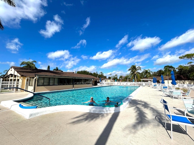 view of swimming pool featuring a patio