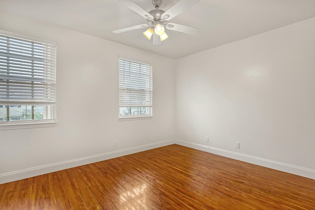 unfurnished room featuring hardwood / wood-style flooring and ceiling fan