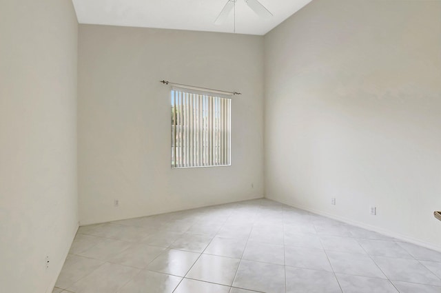 spare room featuring light tile patterned floors and ceiling fan