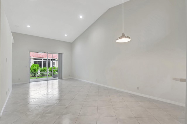 tiled empty room with high vaulted ceiling