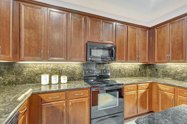 kitchen with tasteful backsplash, dark stone countertops, and black appliances