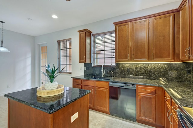 kitchen with a center island, dark stone counters, dishwasher, and hanging light fixtures