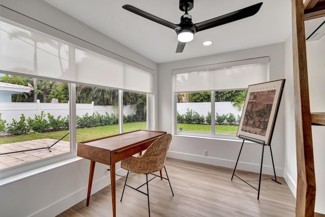 sunroom / solarium with ceiling fan and a healthy amount of sunlight