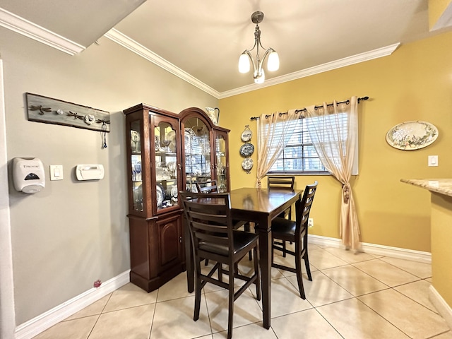 dining space featuring light tile patterned floors, a notable chandelier, and ornamental molding