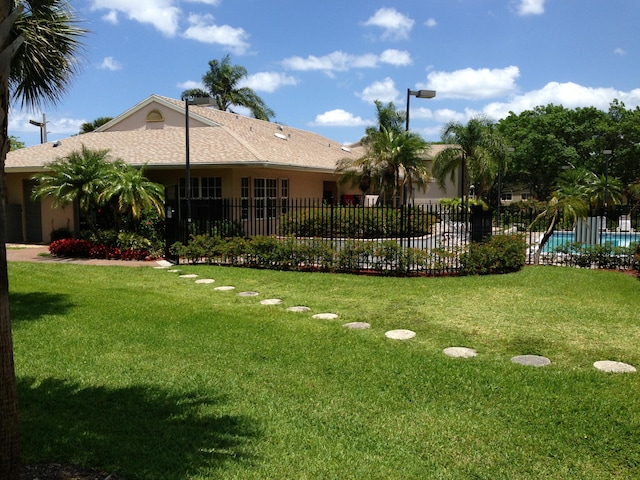 view of yard with a fenced in pool