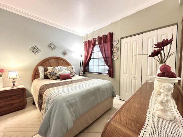 bedroom with crown molding and a closet