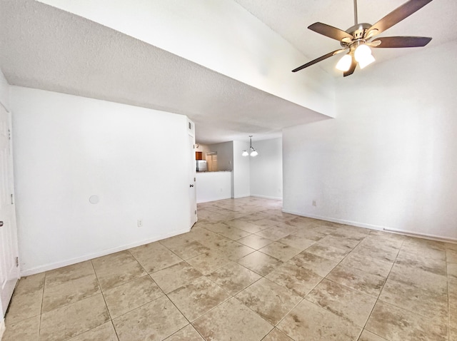 unfurnished room featuring tile patterned flooring, a textured ceiling, and ceiling fan