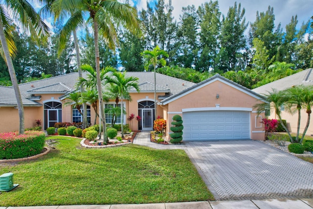 view of front facade featuring a garage and a front lawn