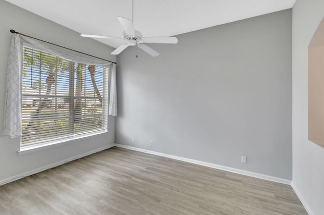 unfurnished room with ceiling fan and light hardwood / wood-style floors