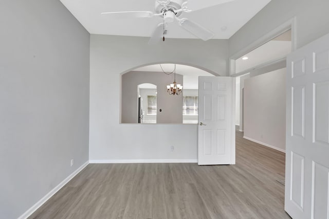 empty room featuring ceiling fan and light wood-type flooring