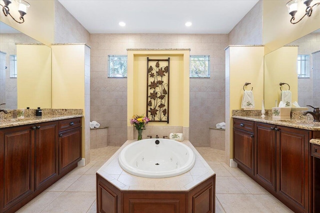 bathroom with vanity, plus walk in shower, and tile patterned flooring