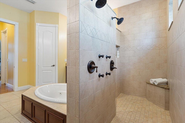 full bathroom with a tile shower