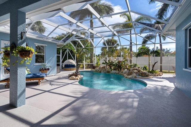 view of swimming pool with a lanai, a fenced in pool, a patio area, and fence