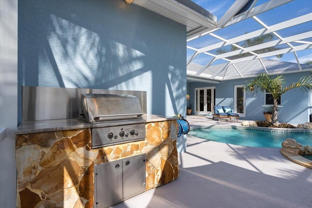 view of patio featuring area for grilling, french doors, a grill, an outdoor pool, and a lanai