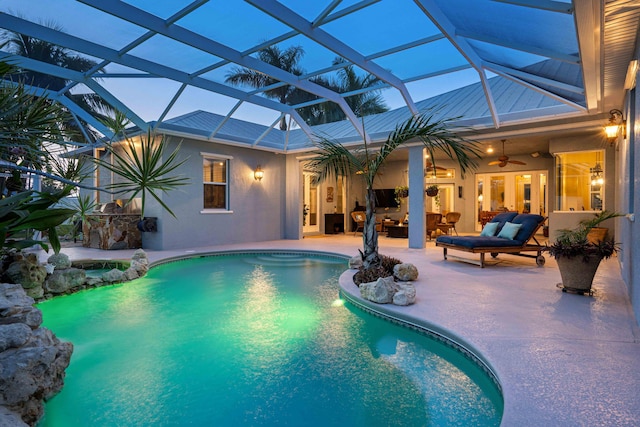 view of pool featuring ceiling fan, an outdoor living space, a lanai, and a patio area