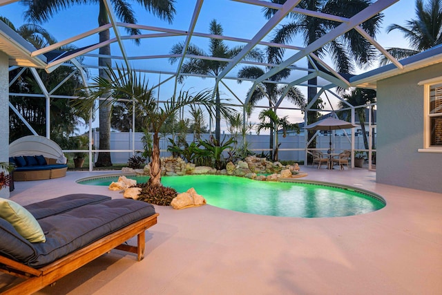 view of pool featuring a lanai and a patio area