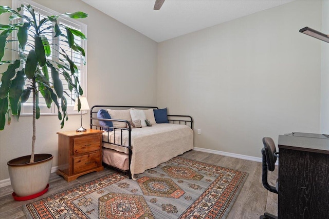 bedroom with ceiling fan and light wood-type flooring