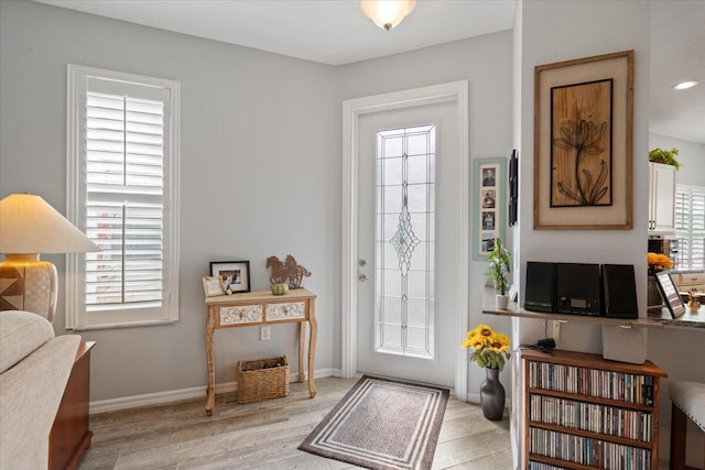 foyer featuring light hardwood / wood-style flooring and a wealth of natural light