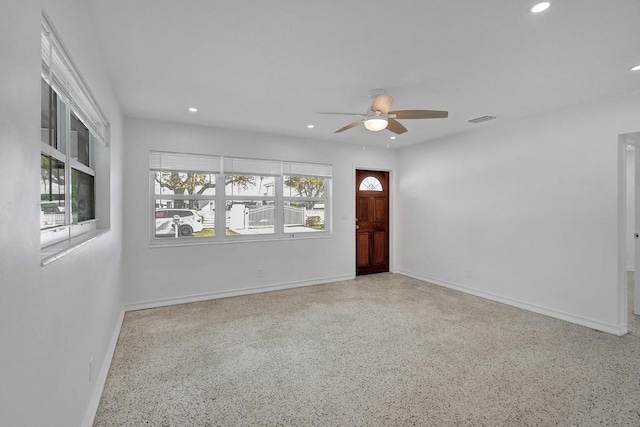 spare room featuring ceiling fan