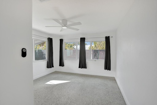 empty room featuring ceiling fan