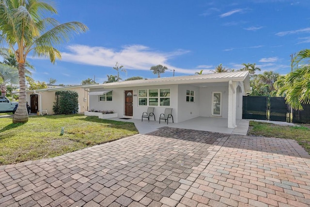 back of house featuring a yard