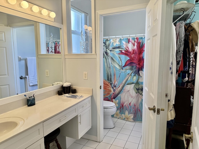 bathroom with tile patterned floors, curtained shower, vanity, and toilet